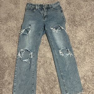 Blue jeans with a hole.